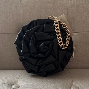 NWT.  A new day bag.  Black Rose-Shaped Bag with Gold Chain
